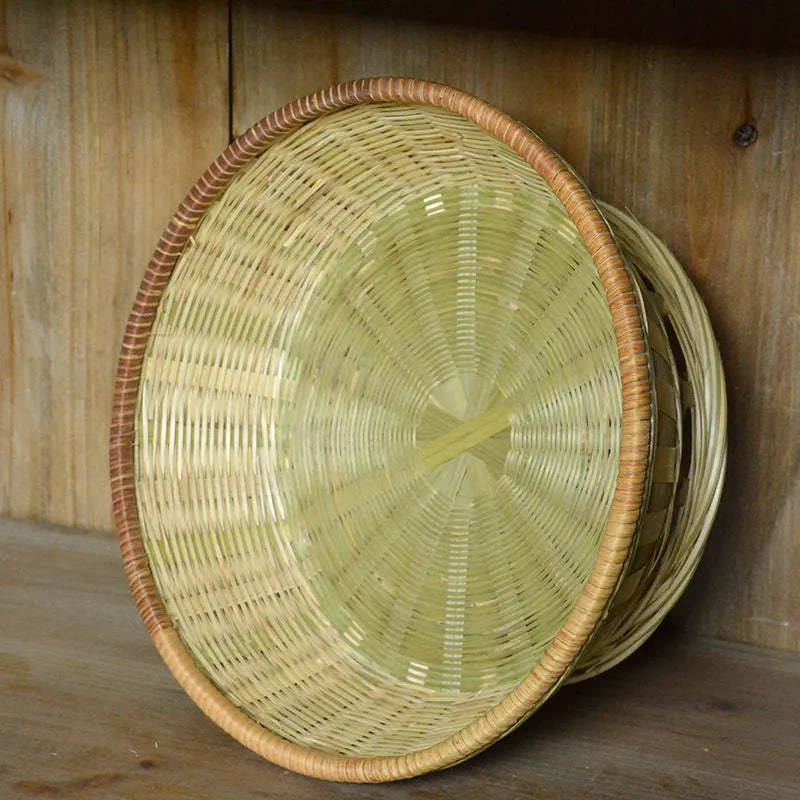 Handmade bamboo storage basket in woven construction showing three size options