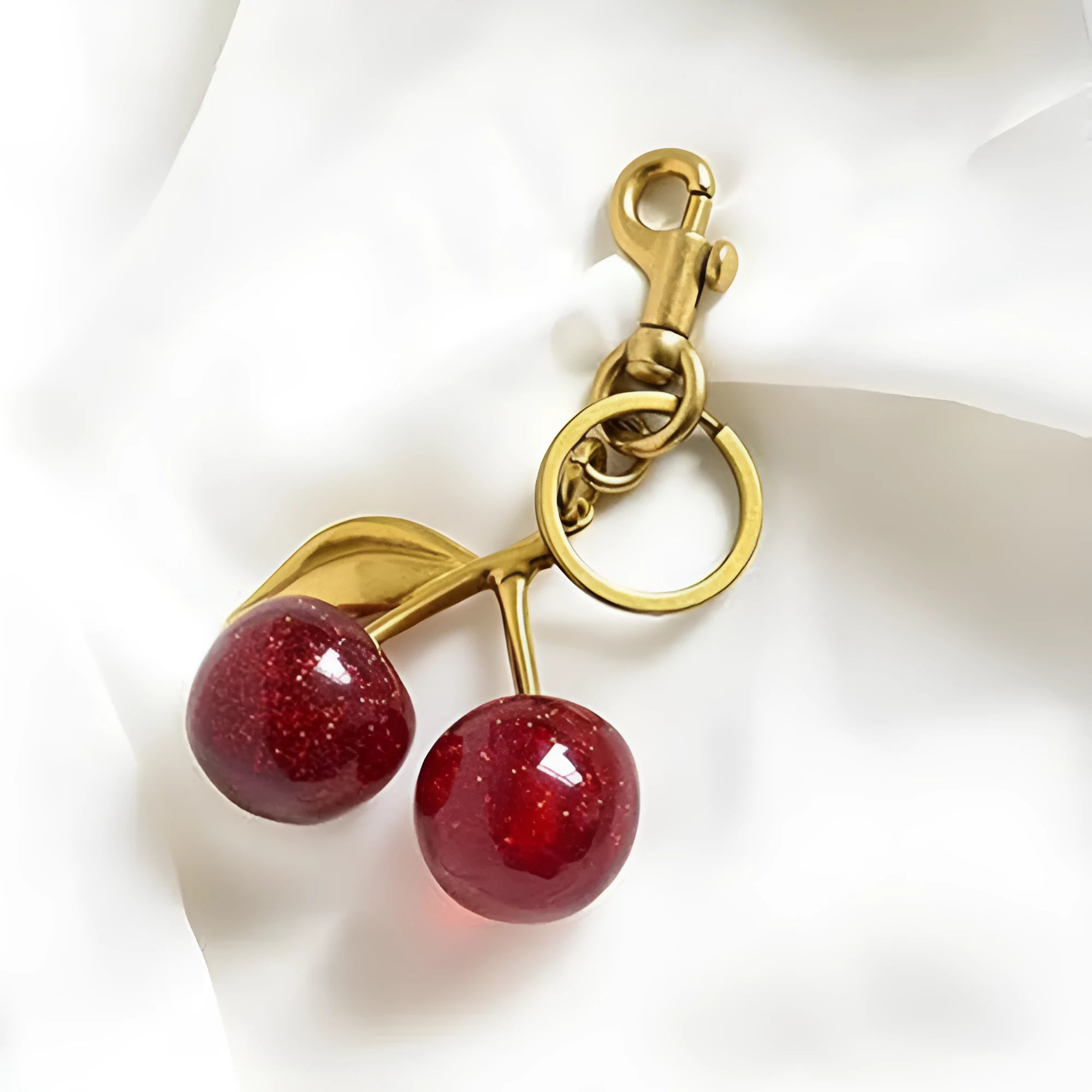 Zinc alloy cherry charm key ring with three-dimensional design in red or pink colour