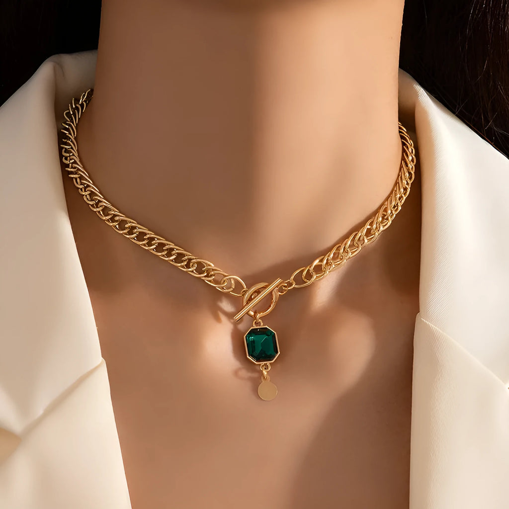 Gold electroplated titanium steel pendant necklace with geometric round design and Cuban link chain