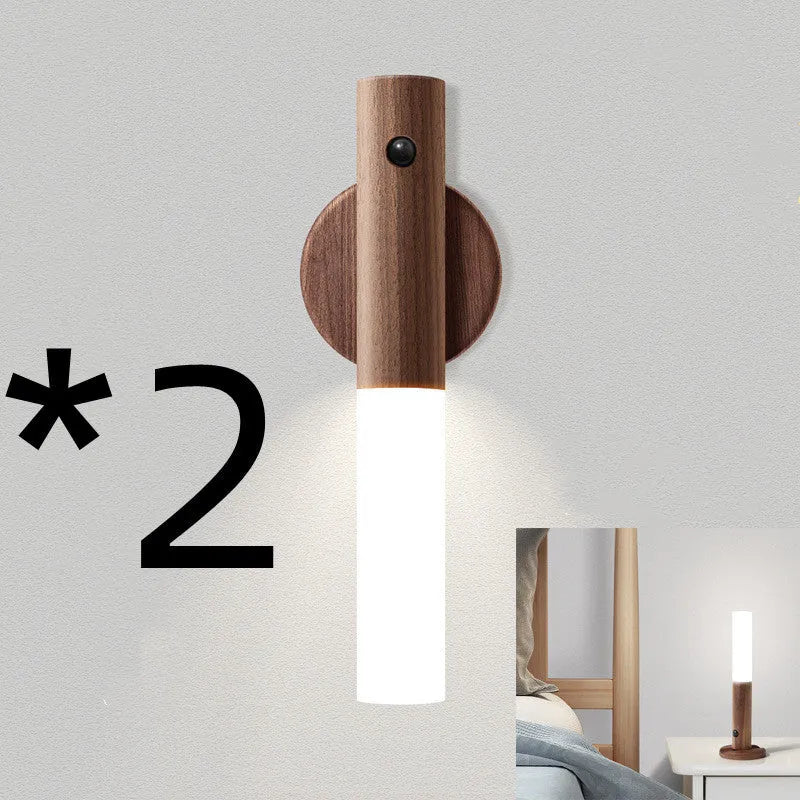 Smart sensor LED desk lamp in wood and acrylic glass on a desk.