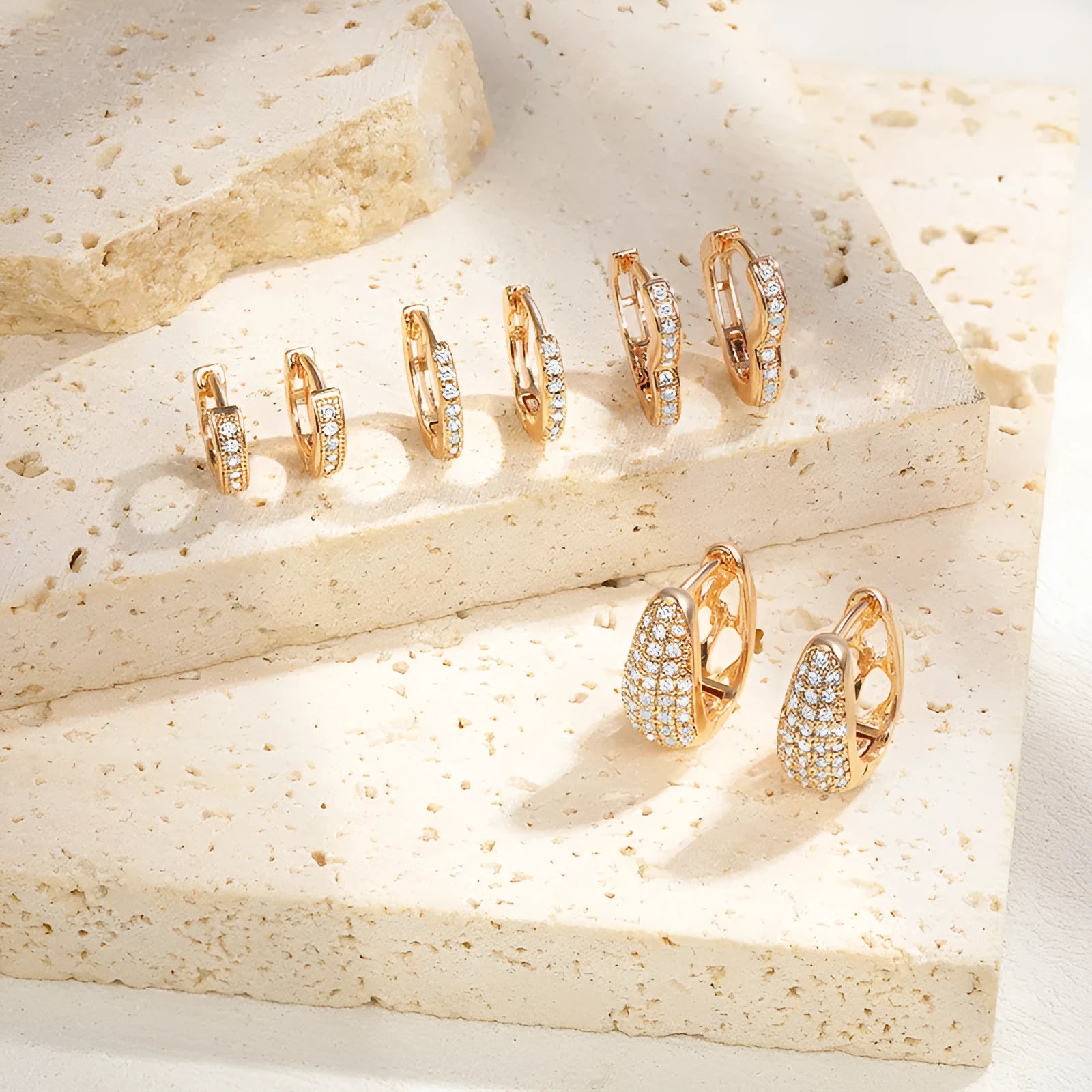 Brass gold plated heart-shaped zircon ear clip earrings with gang drill detailing