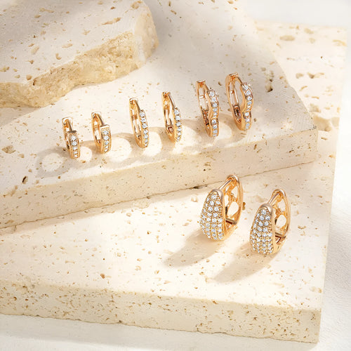 Brass gold plated heart-shaped zircon ear clip earrings with gang drill detailing