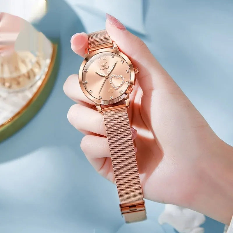 Women's rose gold fashion watch with mesh strap showing six dial colour options