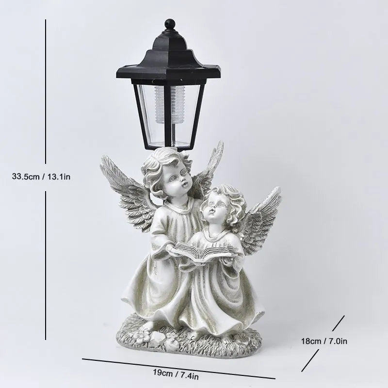Solar hexagonal garden lamp with decorative resin figurine on plastic base for outdoor pathway lighting