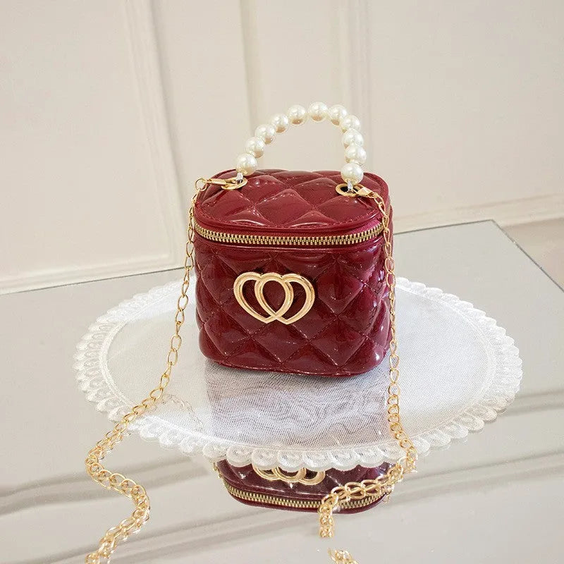 Transparent PVC bucket bag with a heart pattern, shown in one of seven available colours.
