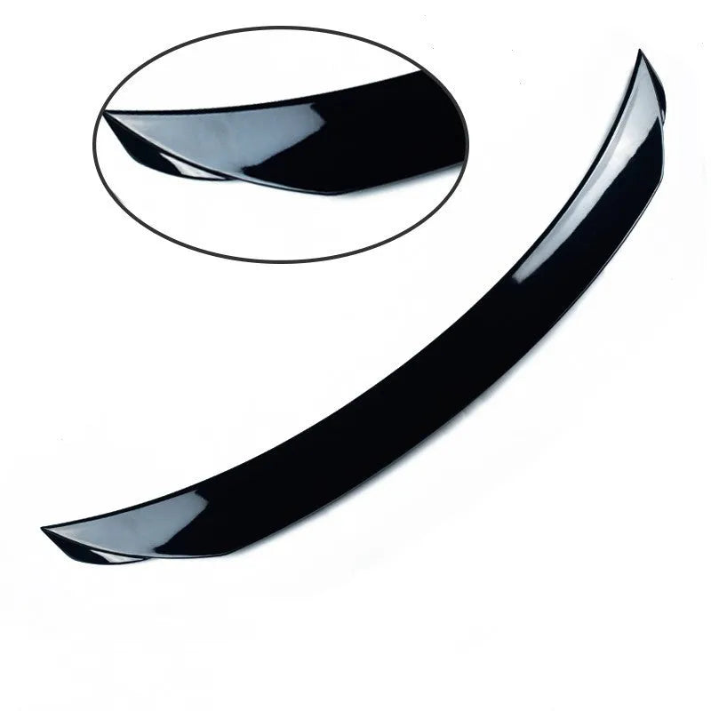 Bright black Mazda 3 Axela Exela tail trim for 2014-2021 models showing large fixed wind surrounded blade design