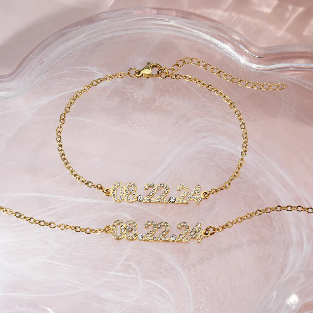 Stainless steel digital bracelet with crystal diamond accents on the numbers, shown in rose gold finish.