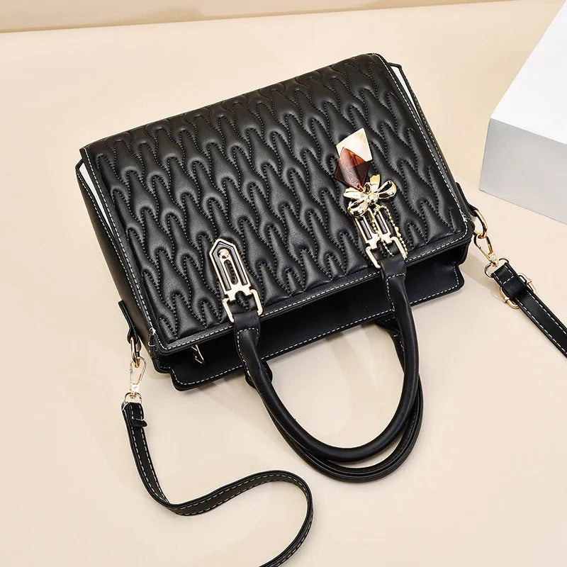 Women's messenger shoulder bag in gold colour showing outer pocket sandwich design and organised interior compartments