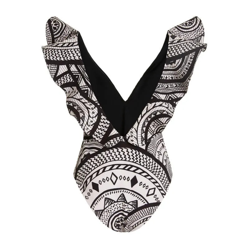 Women's vintage print one-piece swimsuit with deep V-neck, ruffles, and a matching wrap skirt.
