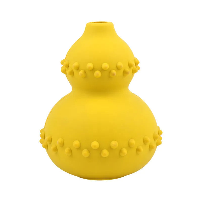 Natural rubber pet toy resistant to biting and grinding, treat dispensing ball in red, 11.3 by 8.5 cm