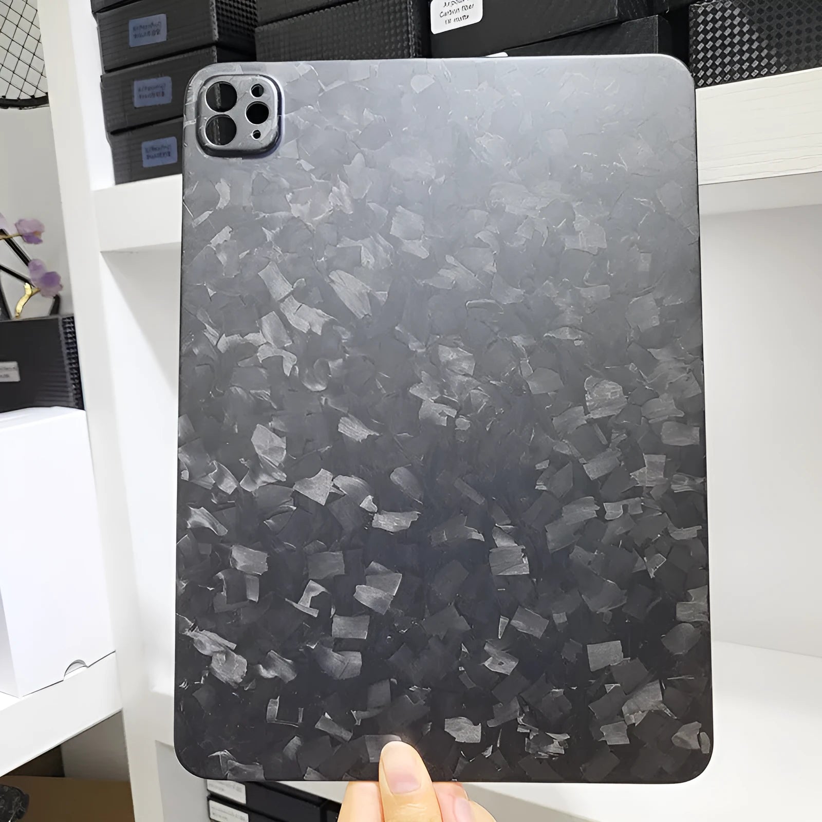 Carbon fibre hard case for Apple iPad Pro 11 with embossed plaid pattern showing three surface finish options