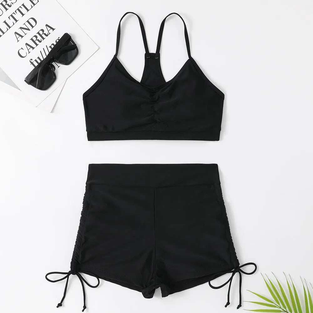 Women's violet high-waist split bikini swimsuit on a mannequin, showing top and shorts.